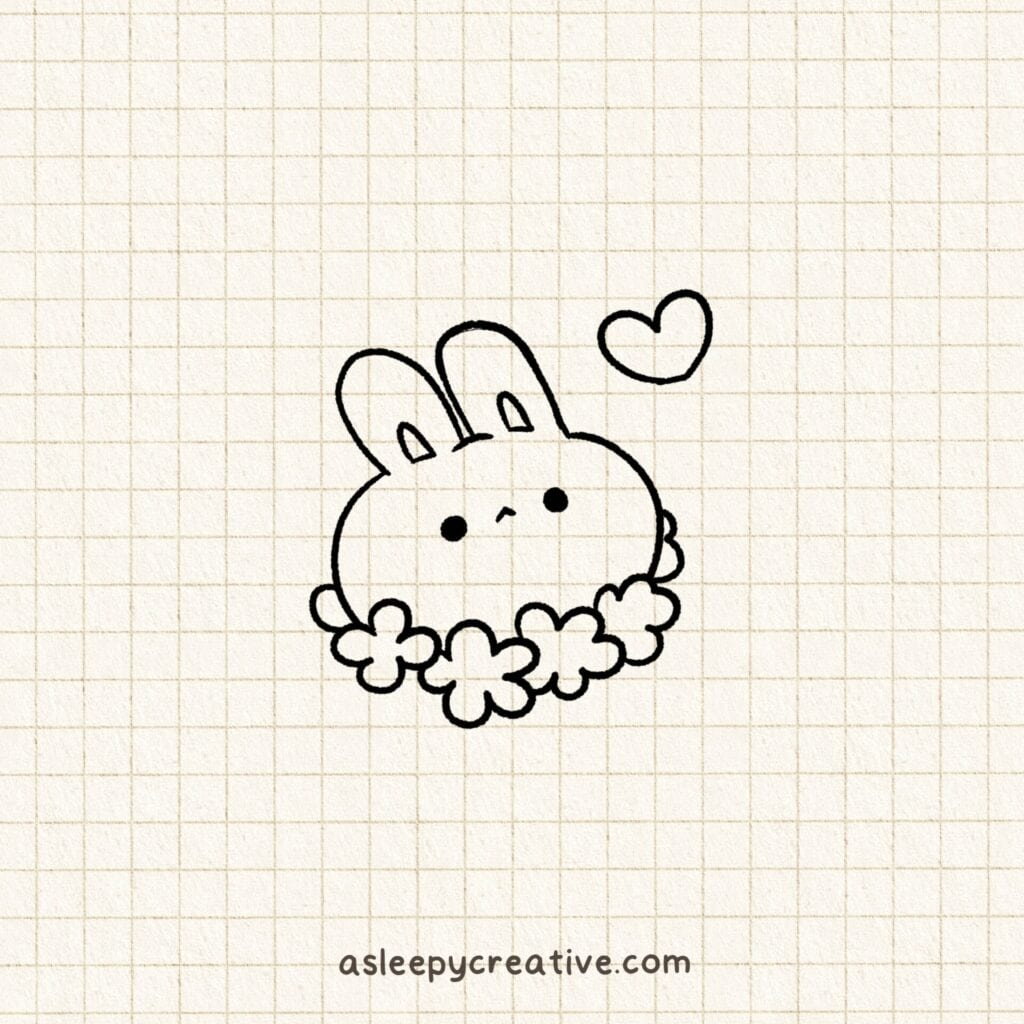 Simple doodle of a round bunny with a flower crown and a heart above its head, drawn on graph paper.