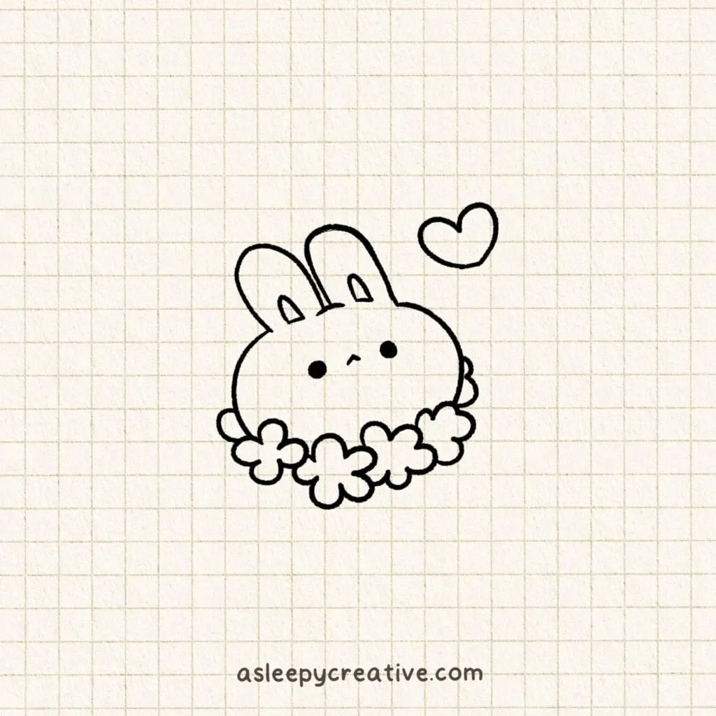 Simple doodle of a round bunny with a flower crown and a heart above its head, drawn on graph paper.